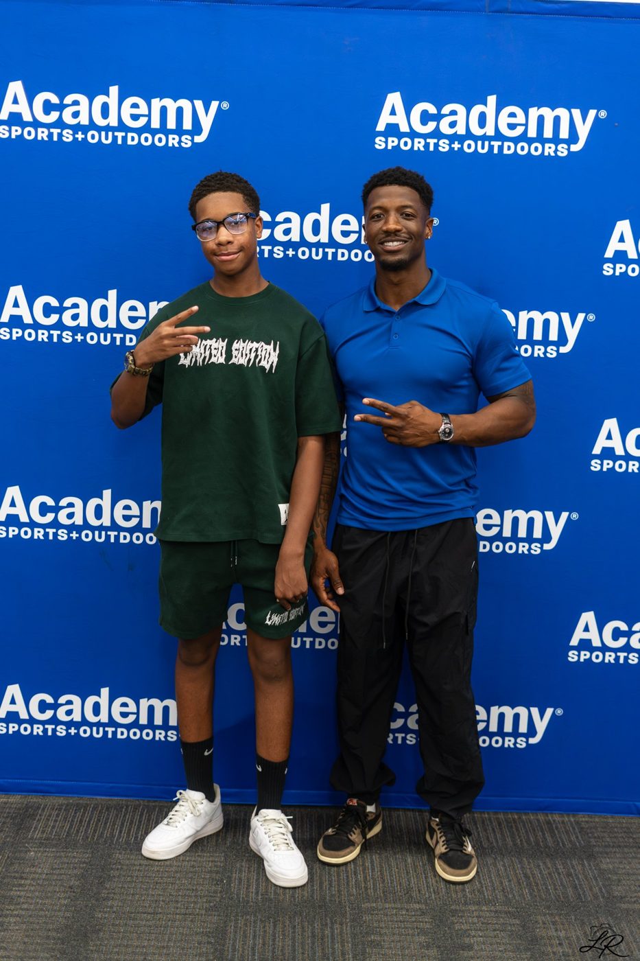Anthony Miller II posing with a young fan at the giveaway event