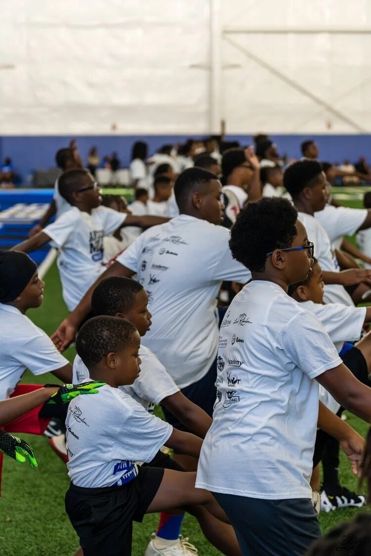 Campers stretching together during warmups