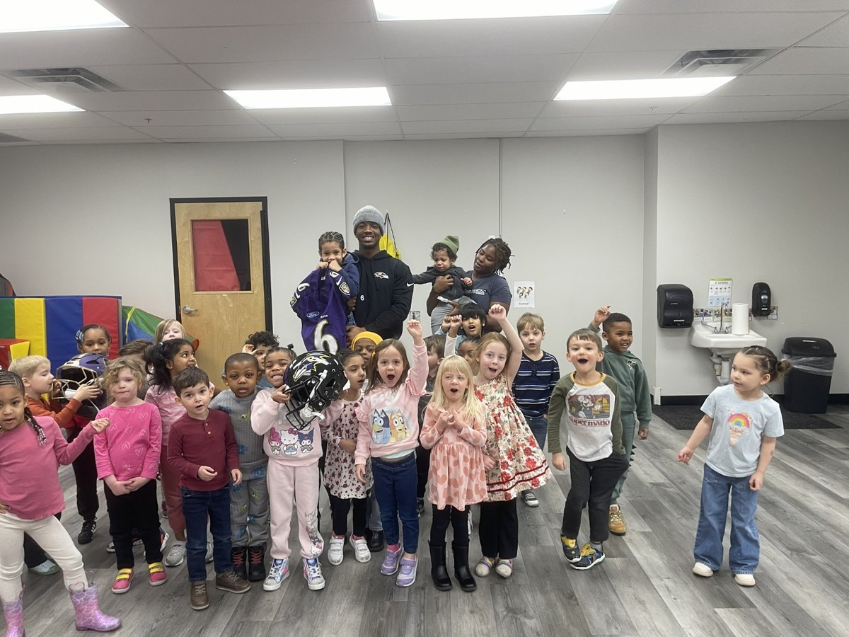 Anthony Miller II with kids doing a holiday craft event