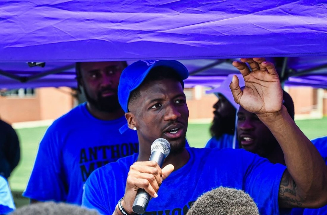 A mentor talking with teens about life skills